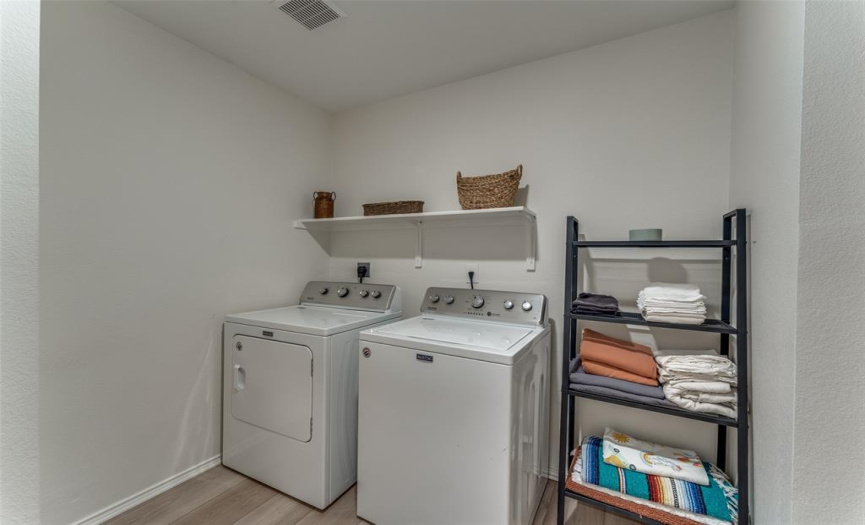 Spacious laundry room with additional space for storage to the right (not pictured)