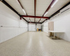 11 ft ceiling, automatic insulated garage door, shelving in Workshop