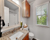 Upstairs bathroom #2.  Updated with granite countertops, mirror, light fixture and luxury vinyl plank flooring.