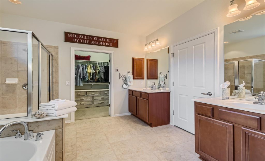 Owner's suite bathroom with dual vanities