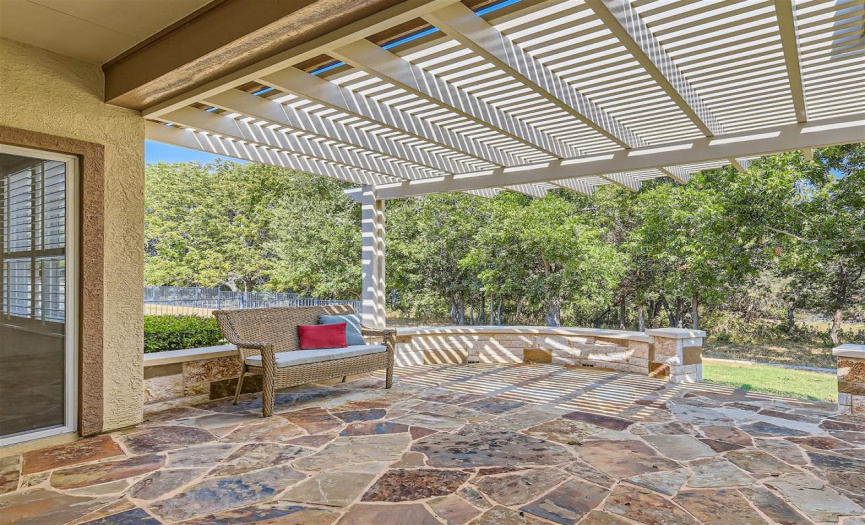Patio offers much privacy with green space located behind home