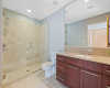 Secondary bath features walk-in shower.