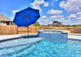 Welcome home and jump in! Beach area in pool and hot tub for relaxing and fun in the sun