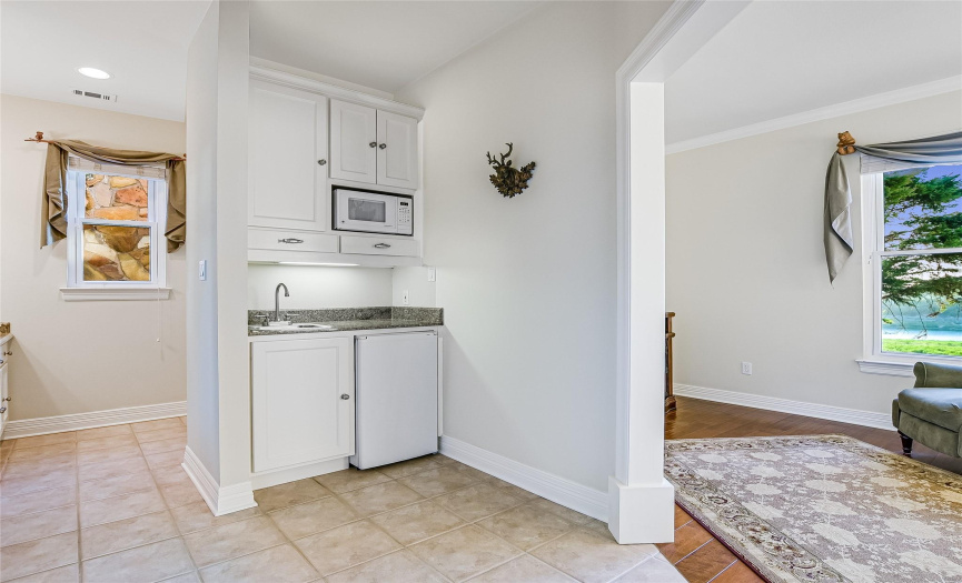 Guests and extended family will appreciate the privacy of the guest suite which includes a mini kitchenette, large closet and bath with walk-in shower.