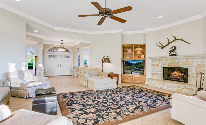 Spacious & open with a tasteful built-in space plus inviting stone-surround fireplace.