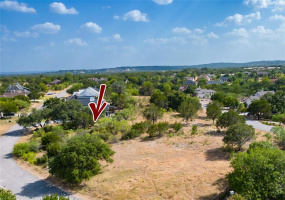 Aerial view of lot.  Likely provides a view of Lake Travis from second story due to topography. 