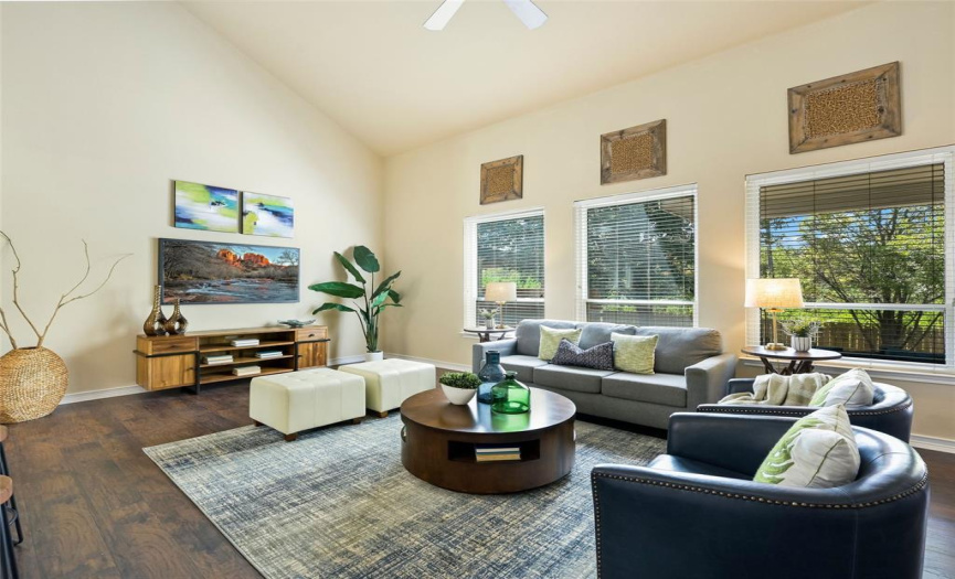 Enjoy the open and airy feel of this family room which boasts vaulted ceilings and an abundance of natural light