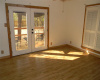 2nd bedroom with French doors leading to backyard deck. 