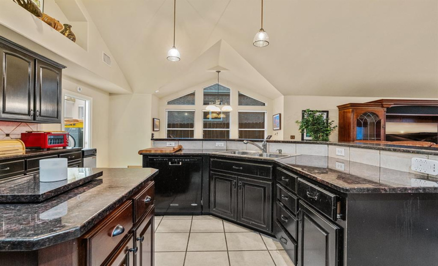 Kitche features stunning granite countertops and large kitchen island!