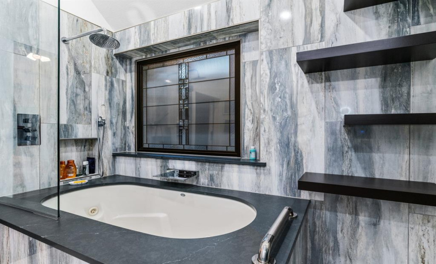 Amazing large jetted tub and shower with stunning tile surrounding