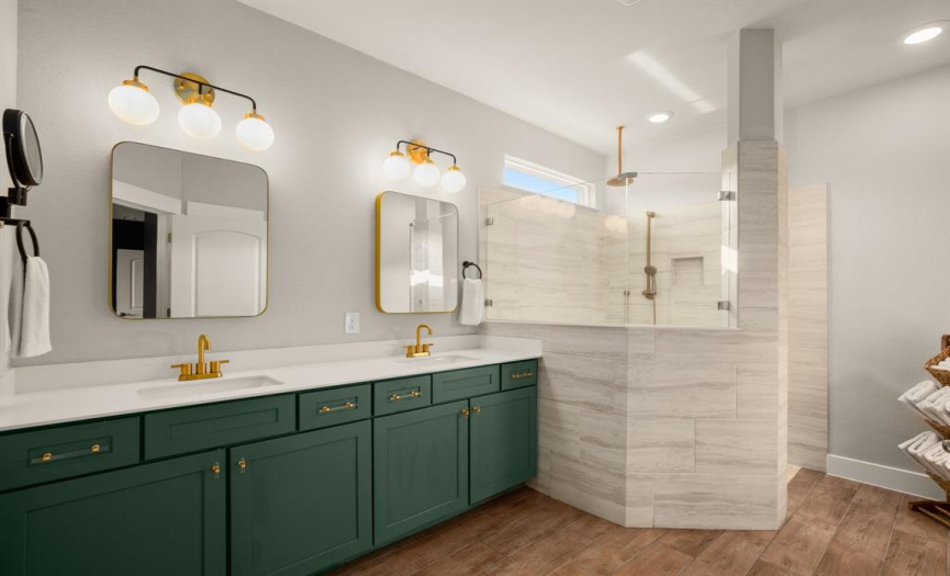 The en-suite spa-like bathroom, complete with a double quartz-topped vanity and an extra-large walk-in shower with a bench seat.