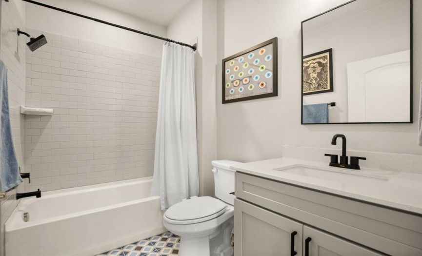 The well-appointed guest bathroom, designed with functionality and style in mind.