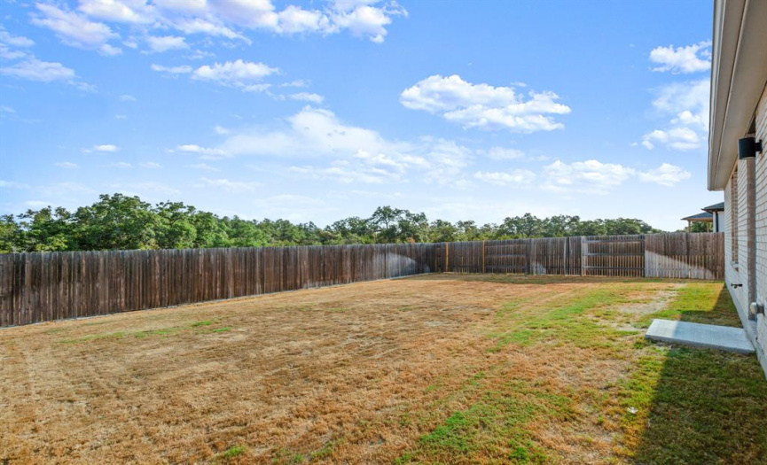 The possibilities are endless in the large fenced backyard, awaiting your creative touch to transform it into your personal outdoor haven.