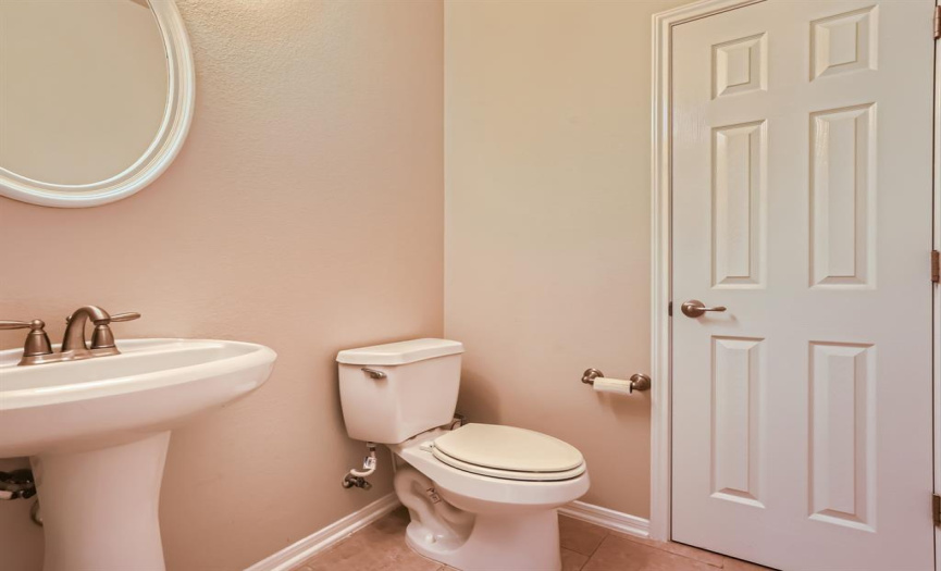 First floor powder room with large storage closet