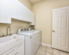 Large Laundry Room with Built-in Shelving
