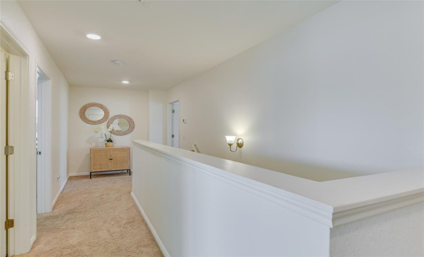 Second floor landing: The advantage of this two-story home is downstairs almost always looks guest ready!