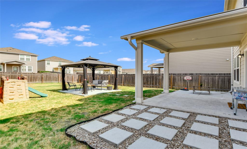 A huge advantage of living in Austin is being outside especially when the weather is cool and crisp. Hang out under the covered patio and be protected from the sun, gather for adult conversation under the Gazebo and watch the kids enjoy the outdoor play equipment in this fenced backyard.