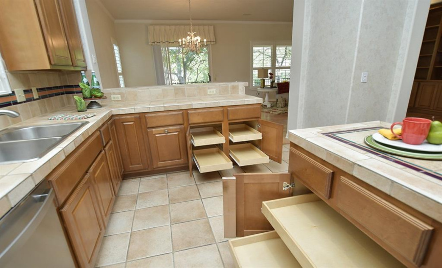 Back-saving roll-outs are found in lower cabinets here in the kitchen and elsewhere in this home as well.