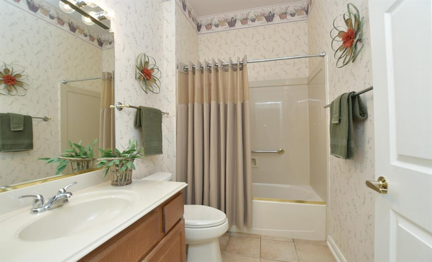 Mere steps from the guest bedroom is the guest bathroom.