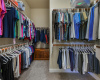 The large walk-in closet offers all the space you need for both clothing and storage