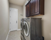 Large laundry room with direct access to the 2.5 car garage. Washer and dryer convey