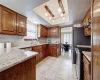 Large kitchen with granite counter, and ample counter and cabinet space.