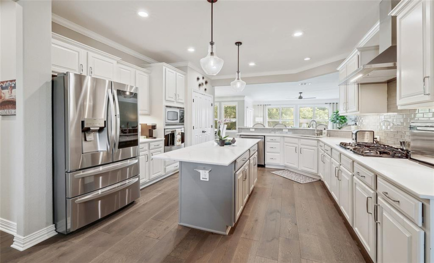 Chef will enjoy a gas cooktop and plenty of counter space in this open kitchen.