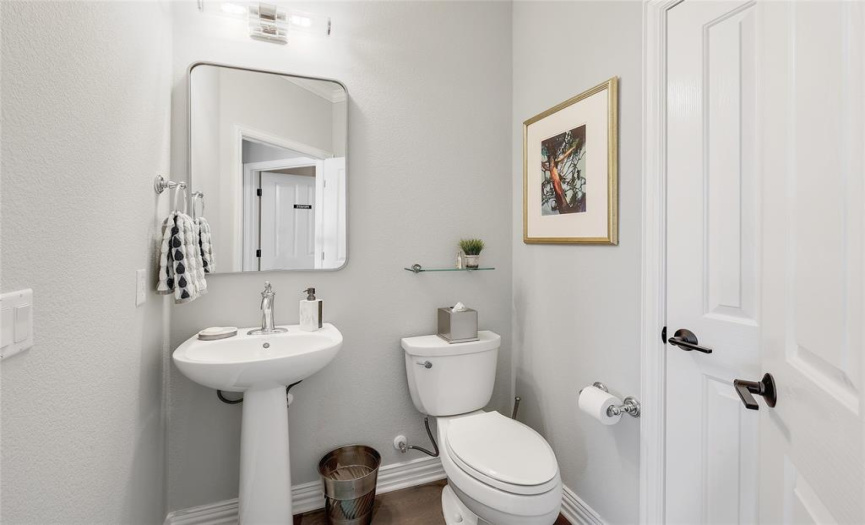A powder room offers guests a 3rd bathroom option in this Cumberland Hall floor plan.