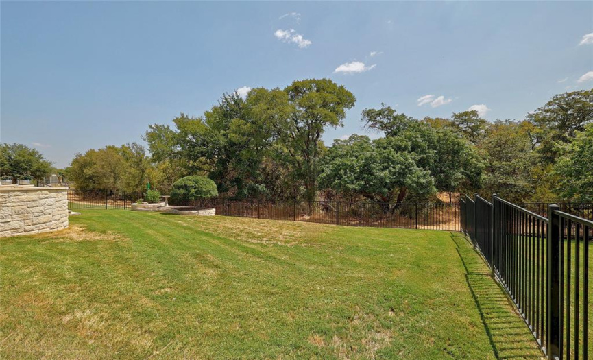 Back yard is fully fenced and abuts a private Sun City greenbelt.