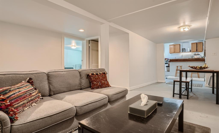 One of two leased units in the triplex. This middle until provides a unique floor plan with a centrally located dining area in between the living room and kitchenette.