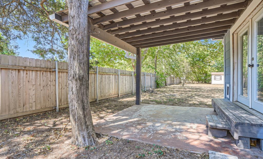 The private covered patio off the main home will serve as your peaceful outdoor retreat space and opens onto the huge backyard.