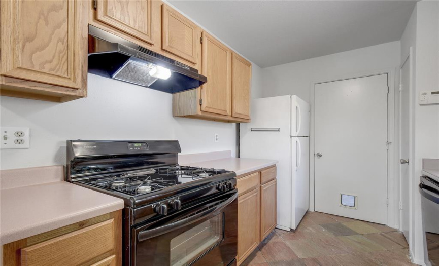 KITCHEN ISN'T FANCY BUT VERY FUNCTIONAL WITH ALL APPLIANCES CONVEYING, INCLUDING WASHER/DRYER. 