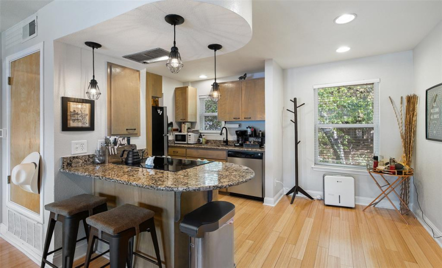 Granite counters adorn thekitchen, with a quaint breakfastbar dividing the kitchen from theliving room.
