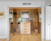 The closet offers ample storageand built in drawers.