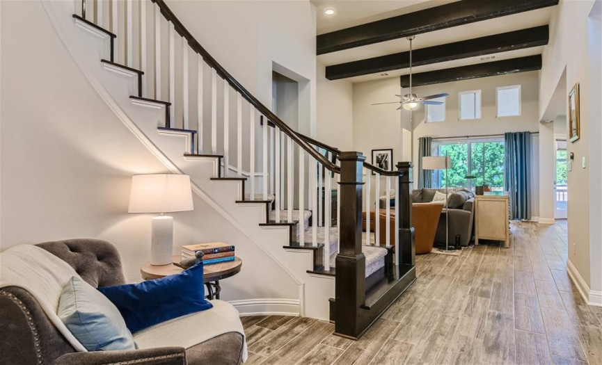 The hallway provides room for a sitting area and offers a view of the stunning open floor plan.