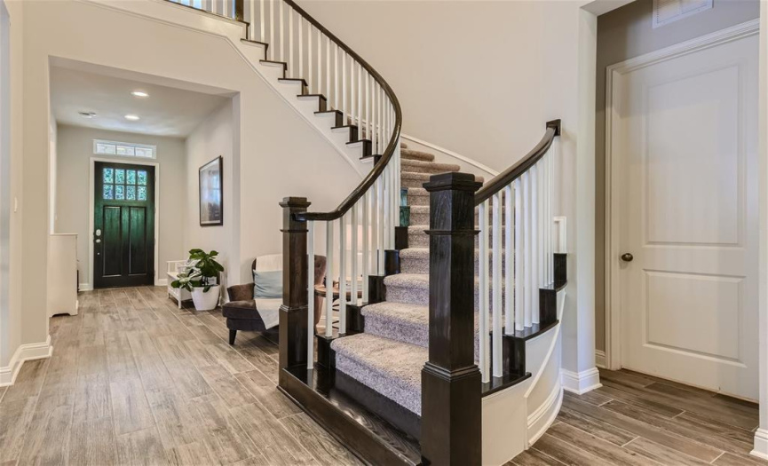 The impressive staircase is conveniently located.