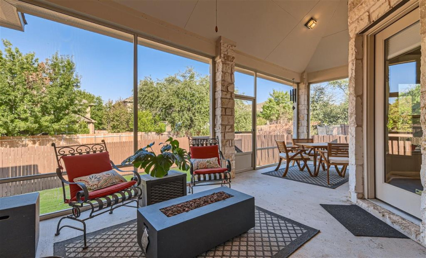 The covered enclosed porch allows for year-round enjoyment.