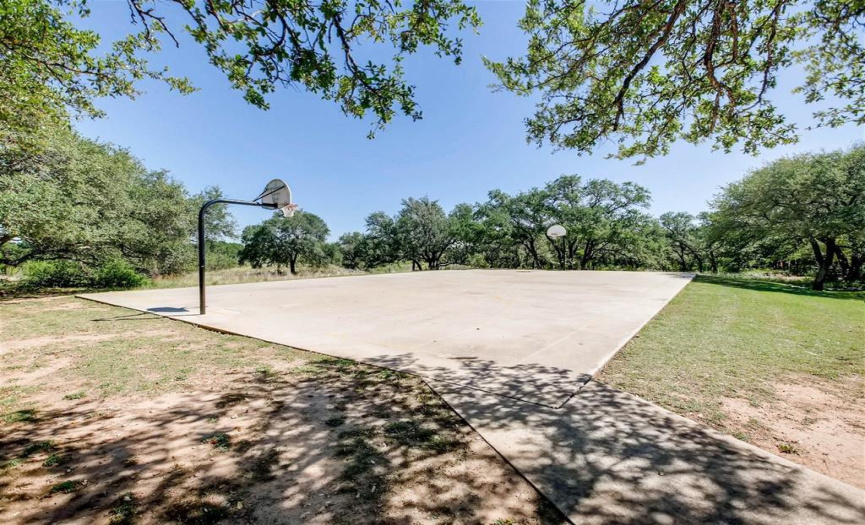 The community basketball court is a great resource for perfecting hoop shots.