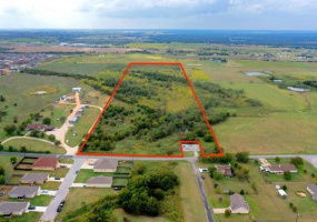 Beautiful 27+ (approx.) acres just a short distance off of I 35 and downtown Jarrell! Pond can be seen in this photo just behind the city of Jarrel Lift station on the right. Acreage is approx as are the property lines in this picture and buyer will want to get a new survey. Pristine property, mature trees, amazing location! Hurry!