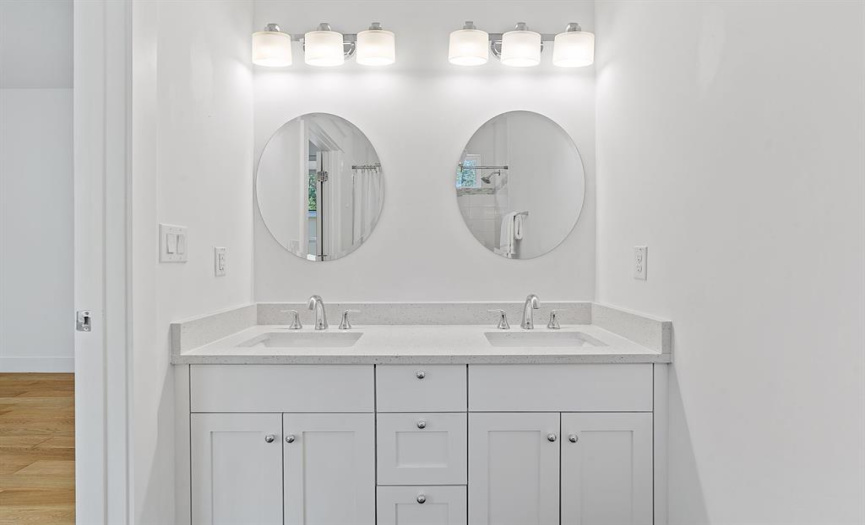 Having a dual vanity in the ensuite full bathroom adds a convenient touch.