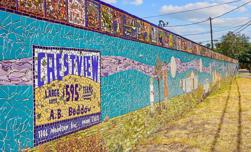 The mosaic 'Wall of Welcome' in Crestview, situated directly across the street, beautifully reflects the community and documents the rich history of the Brentwood and Crestview neighborhoods.