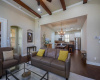 Elegant Great room is accented with the warmth of wood beams.