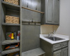 The Mud room with sink and extra storage is located in the utility room