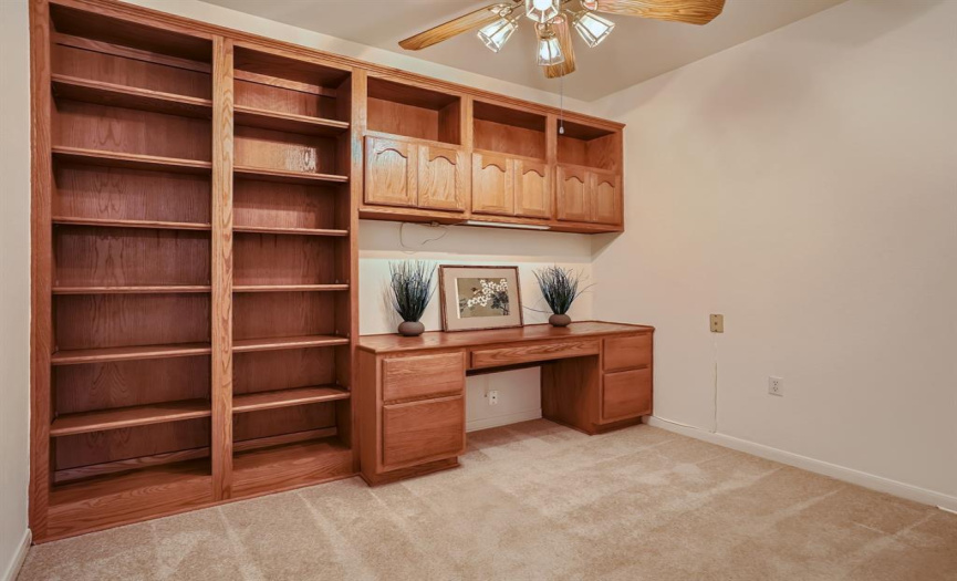 Office with built in desk and bookcases. 