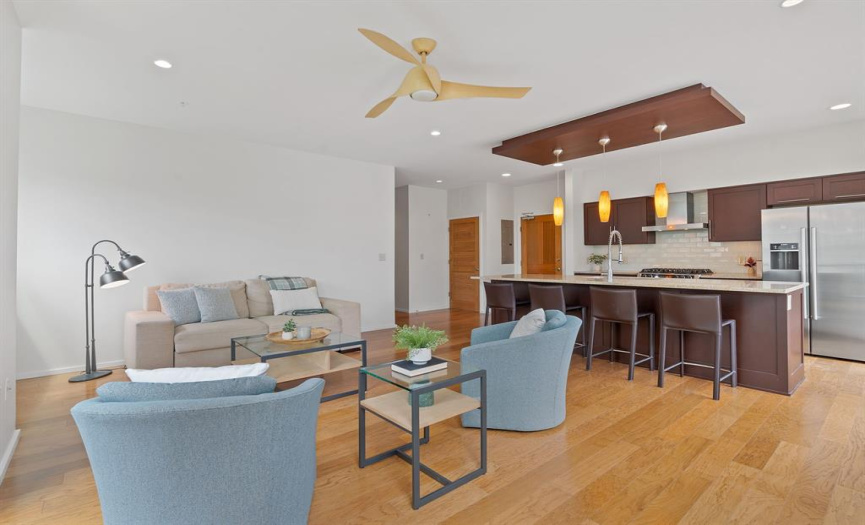 Entertain friends and family in the open-concept living and kitchen area, offering plenty of space for a dedicated dining area beyond the efficient bar seating.