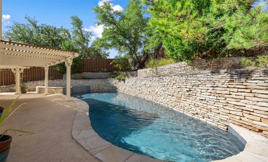 Cool off from the Texas heat with this fabulous private pool, spa, and water feature