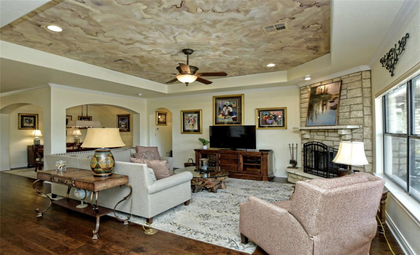 Living area with custom faux ceiling. Tray ceiling for extra height.