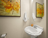The well-appointed main floor guest powder room is easily accessed from the family room. 