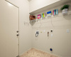 The in-home laundry room is located at the garage entry. 