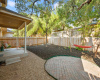 Also enjoy a private, well-shaded, fenced-in backyard boasting a combination of sustainable xeriscape & mulch. 